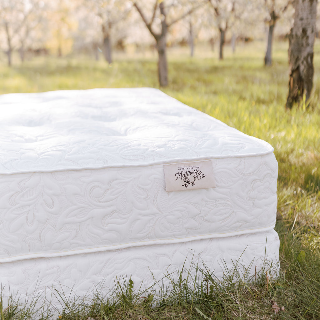Bed of Roses luxury natural mattress photographed in nature.