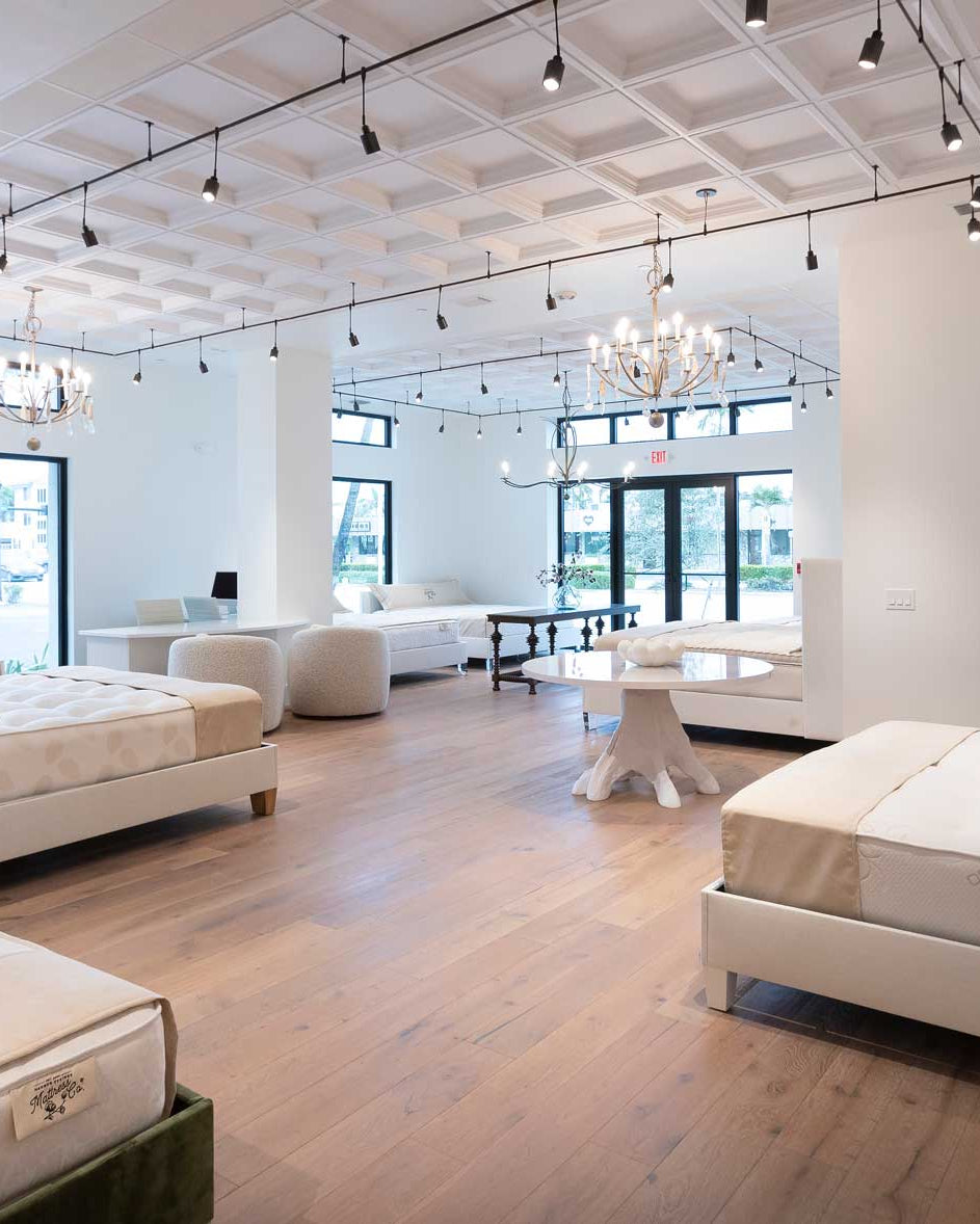 inside of mattress store in Naples Florida with an upscale setting and natural furnishings.